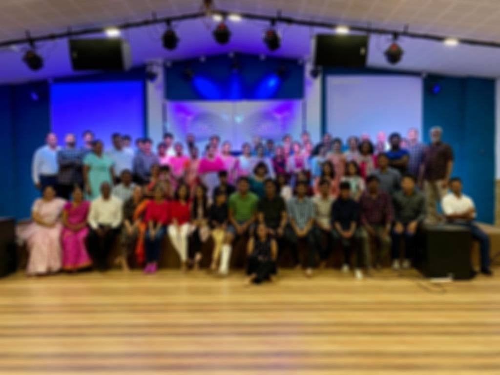 Church members gathered together in the church hall
